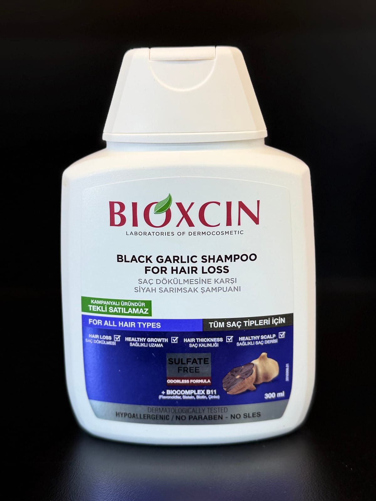 شامپو ضدریزش و حجم دهنده سیر سیاه بیوکسین مدل BLACK GARLIC مناسب موهای ضعیف و نازک حجم 300 میلی لیتر